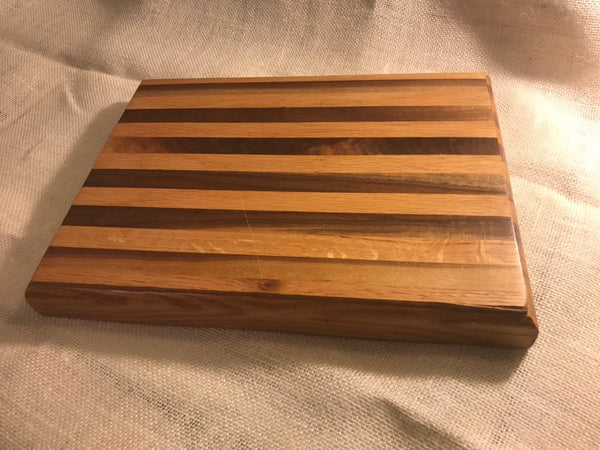 Walnut and oak striped cutting board