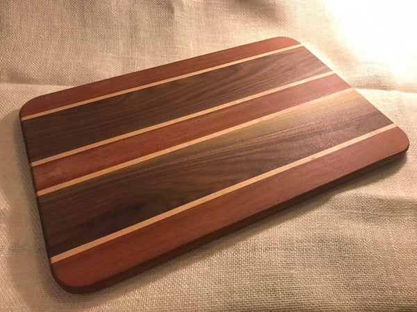 Purple Heart and walnut cutting board with maple strips