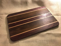 Purple Heart and walnut cutting board with maple strips